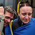 Residents of Oleshky react after being evacuated from their Russian-occupied hometown.
