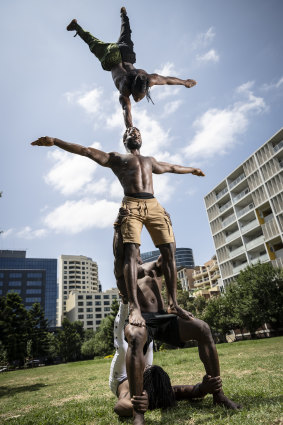 Performers from Afrique en Cirque practise in a park at Parramatta. 