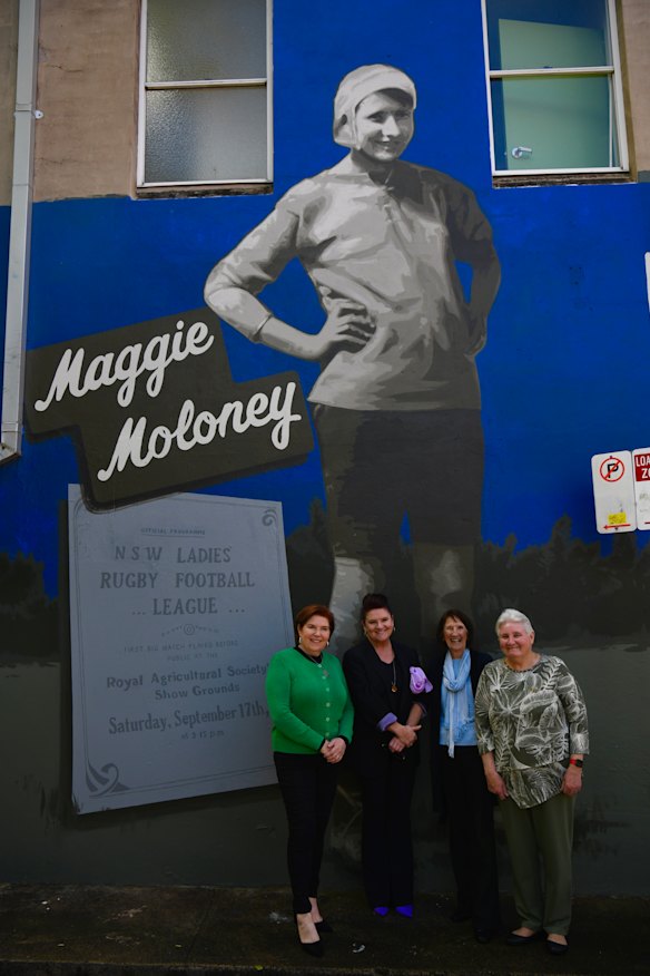 Rugby league player Maggie Moloney’s four granddaughters Karen Heard, Tracey Heard, Margaret Heard and Maureen Black stand at a mural dedicated to their grandmother in Redfern.