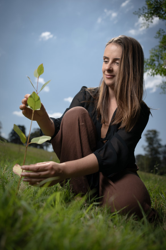 Danielle Packer with recently planted native seedlings.