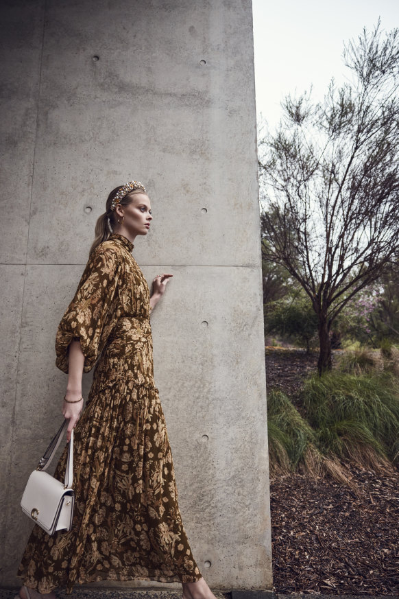 Shona Joy “Rosaline” midi dress, $480; Gregory Ladner headband, $120, from David Jones; Sener Besim gold hoop earrings, $350; 
Coach “Bandit” bag, $995; Aristides Fine Jewels “Chelsea” signet ring, $1150.