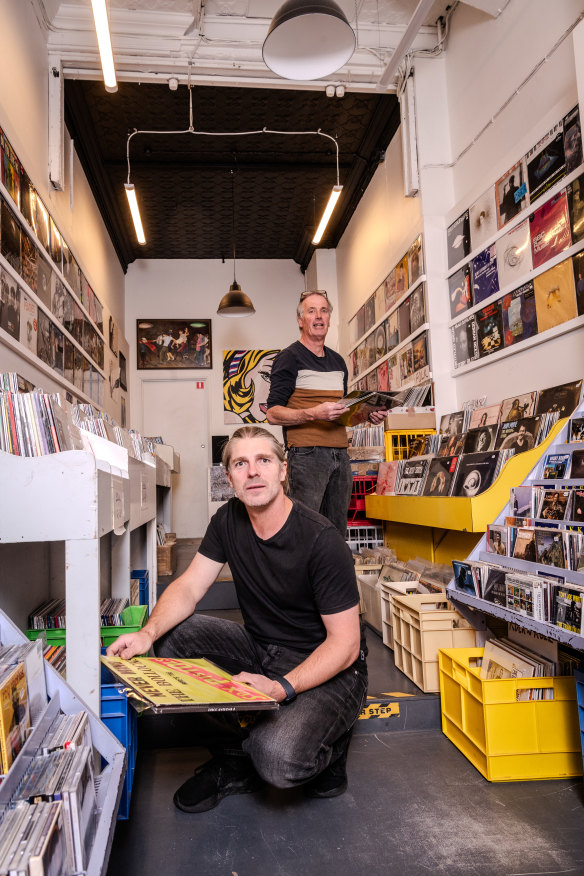 Leigh Carmichael (left) with Music Without Frontiers manager Mel Stewart in the Hobart store. Carmichael made a vow to do everything he could to help save it.