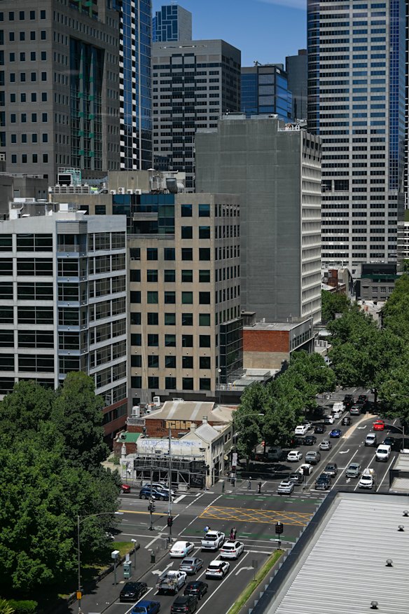 The tiny shop-and-dwelling has gradually been dwarfed by towers that have grown around it.