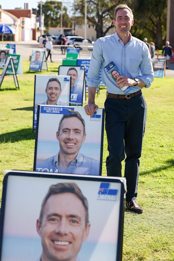White at the polling booth with his corflutes.