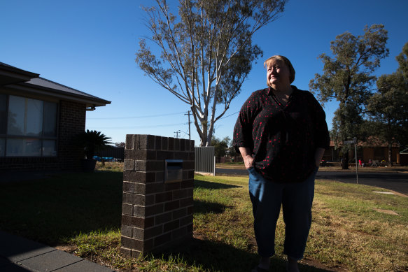 Nerida Baxter outside her house on what is  now known as Rosewood Grove, across the road from Mark Ebsworth.