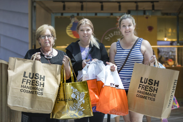Anne Stewart, left, Phoebe Stewart and Jessica Solomon joined the crowd at the Canberra Centre looking for good Boxing Day buys.