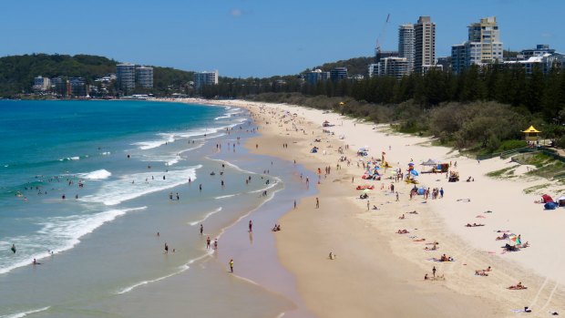 Crowds flock to North Burleigh beach, following the trend from across the state on Saturday.