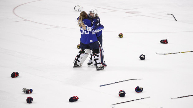 American duo Alex Rigsby and Monique Lamoureux-Morando celebrate their penalty shot victory in the gold medal ice hockey game.