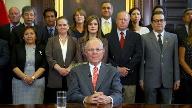 Pedro Pablo Kuczynski poses with his cabinet before addressing the nation and announcing his resignation.