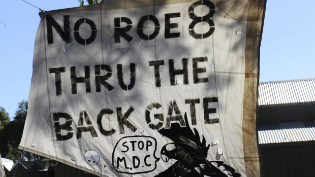 Sign at Cockburn Wetlands Centre's event to mark the a year since work stopped on Roe 8.