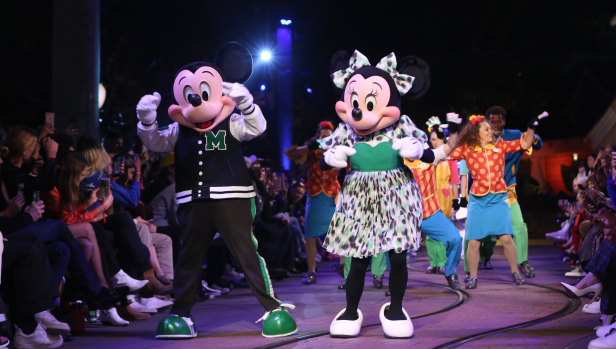 Disney's characters Mickey and Minnie Mouse walk down the runway at the Opening Ceremony Spring 2018 Collection Show. 