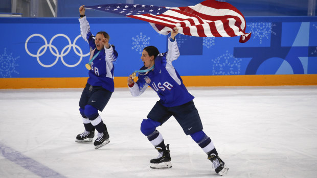 All smiles: Kendall Coyne, left, and Hilary Knight of team USA celebrate after winning gold.