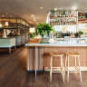 The sun-drenched dining room at Hotel Centennial.