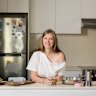 Plastic-free advocate Sarah Rhodes pictured at her home in Mosman with her collection of glass storage containers and sustainable kitchenware.