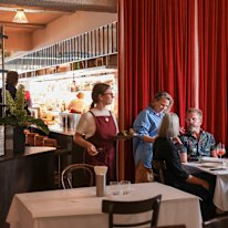 Hannah Green (in blue) on the floor at her sophomore restaurant, Daphne.
