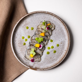 Coconut ash rolled kingfish with buttermilk emulsion.