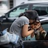 Malini V. farewells her dog, Furphy, at Melbourne Airport last week.