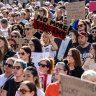 People gather at Federation Square during a rally against women’s violence in April.