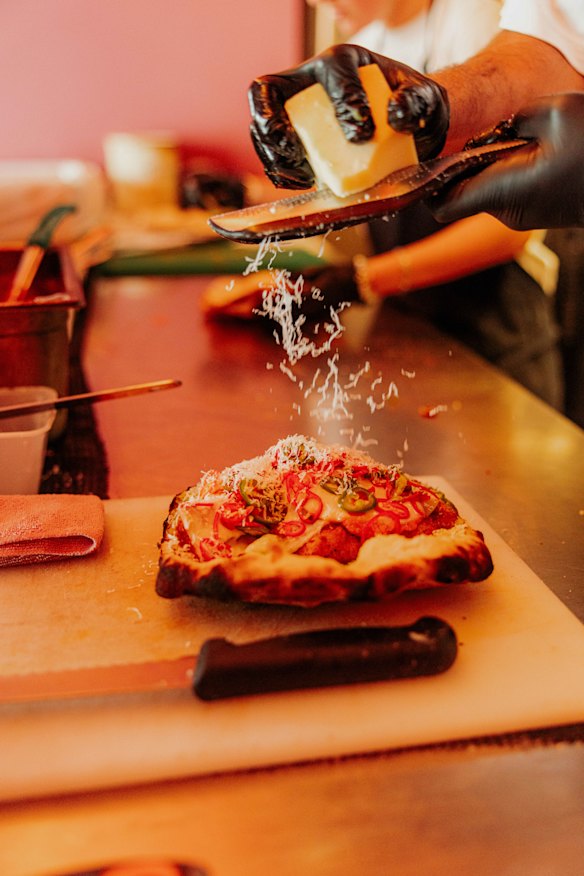 The chicken is nestled in the panuozzo with pickled chillies, pesto and spicy vodka sauce.