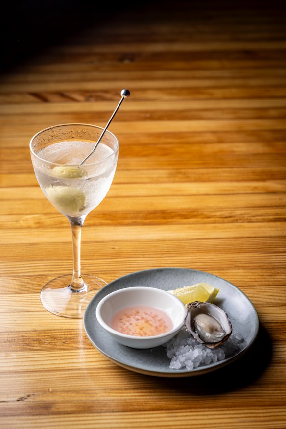 A happy hour deal of a dry martini and an oyster for $25.