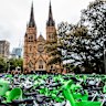 Masses of Lime and other e-bikes in a large fenced off area in front of the Catholic cathedral near Hyde Park.