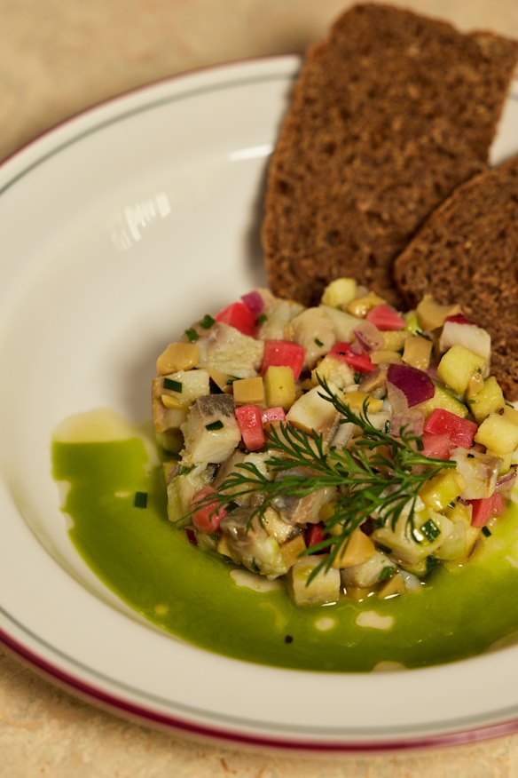 Eat Pierogi Make Love’s tatar ze zledzia with salted herring, crunchy red onion and green apple, pickled champignons and radish.