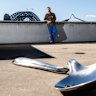  Ricky Swallow with his larger than life wax-printed teaspoons at the MCA in Sydney. 