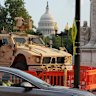 National Guard personnel keep watch near the Capitol, in Washington DC, on Friday.