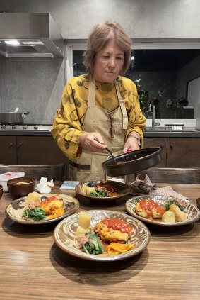 Local sherpa Michiko Nakamoto cooks at the Yambaru Hotel Nammei Shinshitsu.