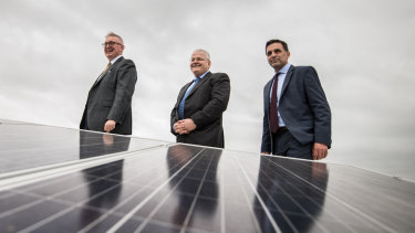 NSW Resources and Energy Minister Don Harwin (left),  John Schroder, CEO of Stockland Commercial Property  and Paul Peters, Verdia CEO, inspect solar panels on the rooftop at Stockland's Wetherill Park. 