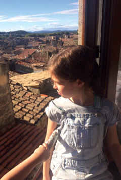 The author’s daughter takes in the view of Sommières from the family flat in the southern French town.