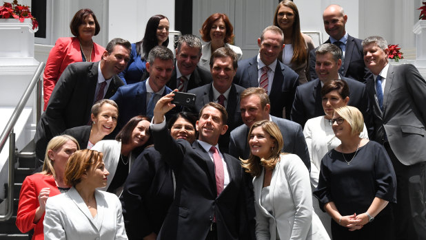 State Development Minister Cameron Dick (centre) takes a selfie with his fellow ministers at Government House.