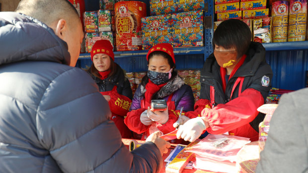 Fireworks and crackers are still popular at a stand in Chaoyang District of Beijing despite a ban of fireworks in the city. 