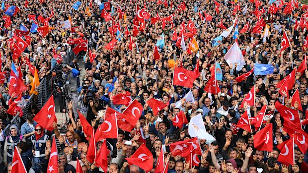 Supporters of Turkey's President Recep Tayyip Erdogan's ruling Justice and Development (AKP) Party, listen to his speech during a rally in Mersin, southern Turkey, on Saturday.