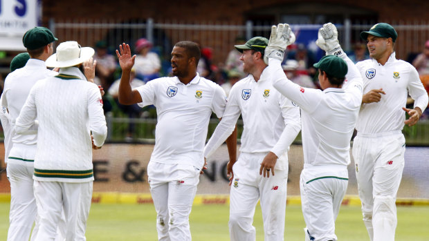 Not me: Vernon Philander (centre) denies being the author of a tweet attacking Steve Smith.