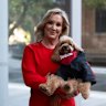 Gina Edwards and Oscar the cavoodle after she won her defamation case against Nine.