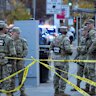 Members of the National Guard gather two of their colleagues were shot near the White House.