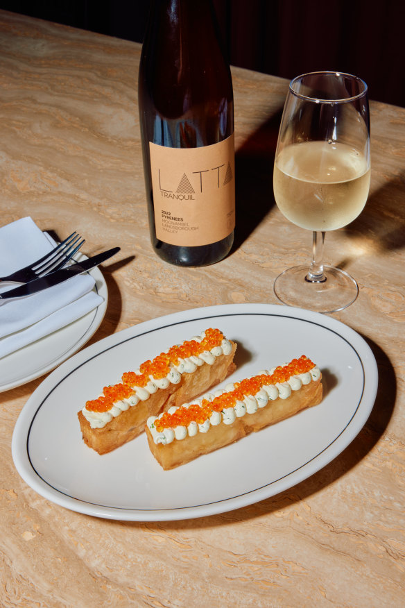 Fried potato pave, herb cream cheese and trout roe.