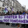 Pro-abortion rights activists hold banner reads “abortion is a fundamental right” during a recent rally for abortion rights in Paris.
