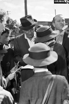 Sinatra signs autographs before rehearsal at Sydney Stadium.