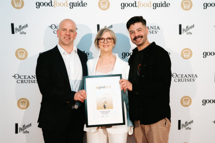 The Age Good Food Guide 2023 editor Roslyn Grundy (centre) with Josh O’Brien (left) and his partner Omar Viramontes, whose Ferntree Gully cafe Lorna was awarded Cafe of the Year.