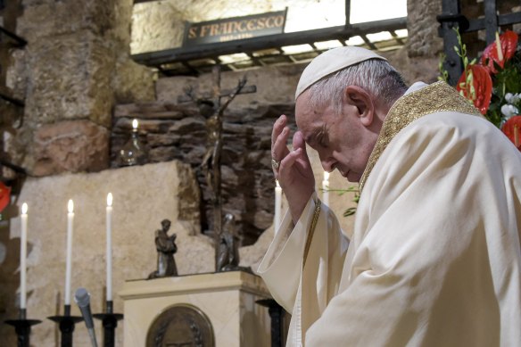 Pope Francis celebrates Mass in the crypt of the Basilica of St Francis, in Assisi, Italy, on Saturday, in his first trip outside of the Vatican for many months due to the pandemic. 