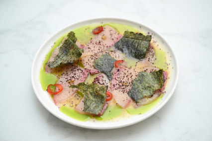 Kingfish with yuzu dressing, chive oil, pickled red chilli and laver.