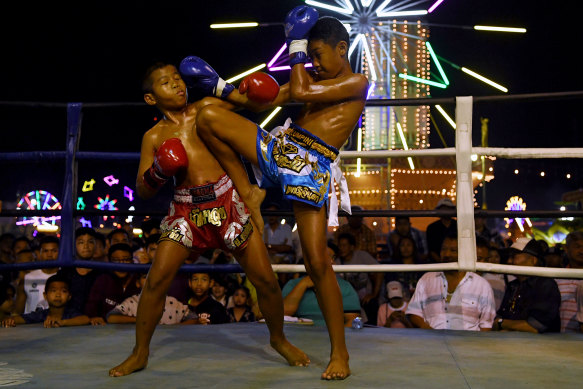 Samsun is hit by his opponent during a Muay Thai fight.