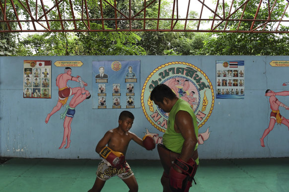 Samsun during his afternoon training session with his trainer Suk Mongkon at the Nor Naksin Muay Thai camp where he lives and trains.