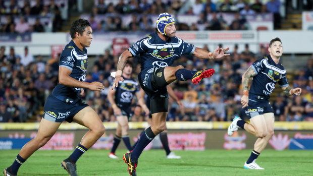 Talisman: Johnathan Thurston sets the Cowboys in motion in his 300th NRL match.