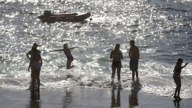 Beachgoers took to the water at Clovelly to beat Sunday's stifling heat.