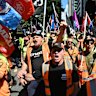 Union members call for the scrapping of the FWO during a CFMEU rally in Brisbane on April 5.