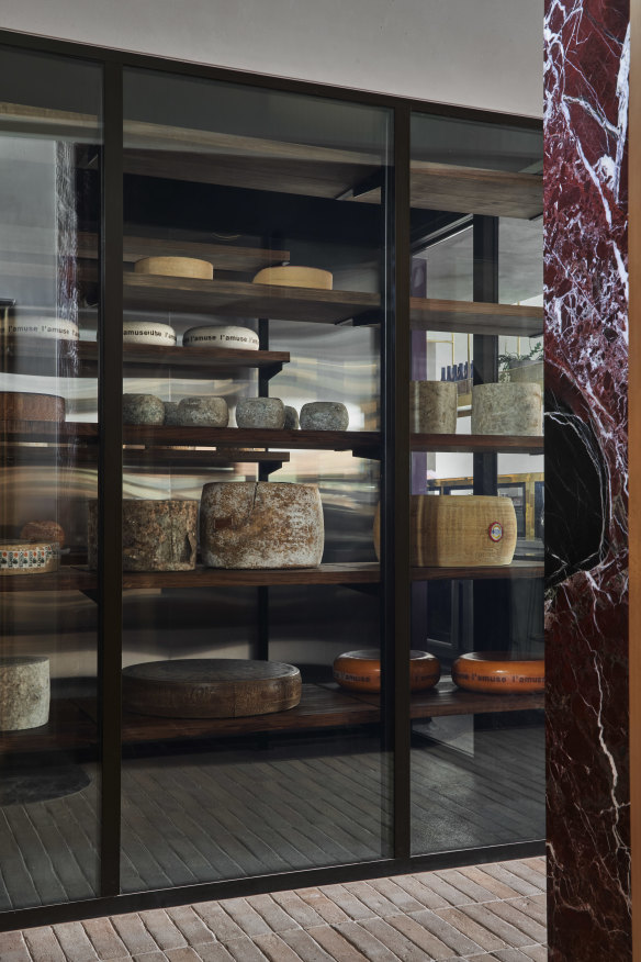 A wall of cheese greets diners when they arrive.