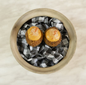 Pork croquettes with ’nduja mayonnaise and finger lime.